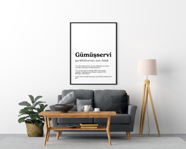 A minimalist wall art print featuring the Turkish word "Gümüşservi" in bold, black text. Below it, a pronunciation guide and definition describe the word as "the silver glow of the moon's reflection on water, casting a peaceful, shimmering path."