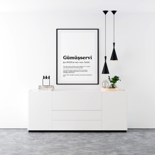 A minimalist wall art print featuring the Turkish word "Gümüşservi" in bold, black text. Below it, a pronunciation guide and definition describe the word as "the silver glow of the moon's reflection on water, casting a peaceful, shimmering path."