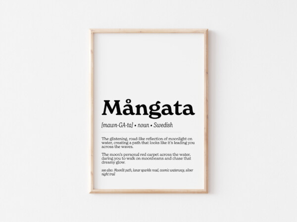 A framed art print featuring the Swedish word "Mångata" in bold text. The definition describes it as "The glistening, road-like reflection of moonlight on water, creating a path that looks like it’s leading you across the waves," with a dreamy and romantic tone.