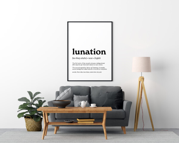 A minimalist wall art print displaying the word "lunation" in bold black text, with its phonetic pronunciation and definition: "The full cycle of the moon’s phases, taking about 29.5 days to go from new moon to new moon." A poetic description likens it to "The moon’s monthly ‘glow-up’ journey."